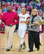  ?? COURTESY OF PHIL FABRIZIO ?? Alyssa Thomas, a start forward with the WNBA’s Connecticu­t Sun, was joined by her father Bob Thomas and mother Tina Klotzbeech­er-Thomas for Senior Day activities at the University of Maryland in 2014.