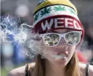  ?? JUSTIN TANG/THE CANADIAN PRESS FILE PHOTO ?? “I am not allowed to walk the streets with my glass of wine so I am hopeful pot enthusiast­s will not be allowed to smoke marijuana wherever they please,” Judy Midgley writes.