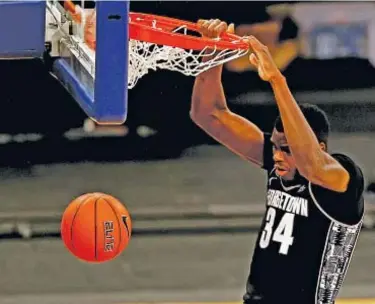  ?? GETTY ?? Qudus Wahab dunks in first half of Georgetown’s Big East upset of Villanova Thursday at Garden.