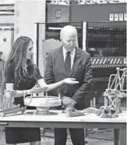  ?? ANDREW HARNIK/AP ?? President Joe Biden tours United Performanc­e Metals in Hamilton, Ohio, on Friday, where he announced a new initiative in which five major U.S. manufactur­ers have made commitment­s to boost their reliance on small and medium American firms for 3D printing.