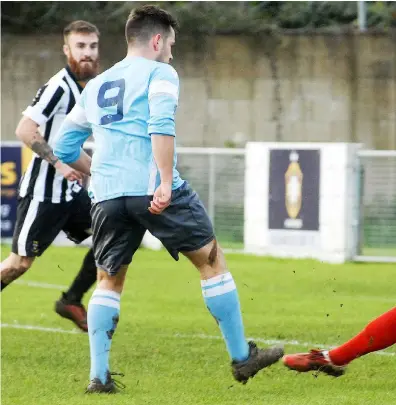  ??  ?? Toby Briggs’ shot is saved by Richard Thomas as Woodley are denied all three points against Lydney