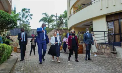  ?? Photograph: Anadolu Agency/Getty Images ?? Priti Patel, centre, with the mayor of Kigali, Pudence Rubingisa, left, visiting a place allocated for refugees in Kigali, Rwanda, 14 April 2022.