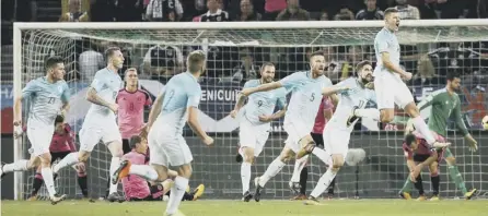  ??  ?? 0 Clockwise from main image: Leigh Griffiths fires Scotland into the lead after 32 minutes; Robert Snodgrass hooks the ball past the keeper to equalise in the 88th minute and revive hopes of a dramatic late winner; Slovenia substitute Roman Bezjak...
