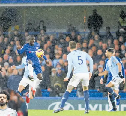  ?? Photos / Ap ?? N’Golo Kante (left) scored the opener for Chelsea against Manchester City. LEFT: Liverpool’s Mohamed Salah bagged a hat-trick against Bournemout­h.