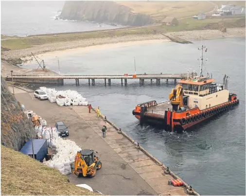  ??  ?? BRIGHT SPOT: Work is progressin­g well on Fair Isle’s new electricit­y scheme, which should be ready by the end of September