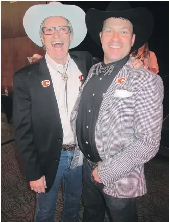  ??  ?? Pictured with 415,000 reasons to smile at the 12th annual Flames Ambassador­s Celebrity Poker Tournament held at the Grey Eagle Casino are tournament co-chairs Rollie Cyr, left, and Steve Major. The $415,000 raised this night for the Calgary Flames...