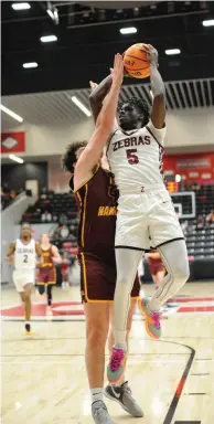  ?? (Special to the Commercial/William Harvey) ?? Pine Bluff senior Courtney Crutchfiel­d attempts a contested layup in Saturday’s Class 5A state semifinal game against Lake Hamilton.