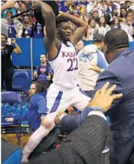  ?? GETTY ?? Silvio De Sousa raises stool during college brawl.