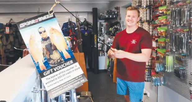  ?? Picture: JUSTIN BRIERTY ?? CATCH A BARGAIN: Sean Richardson at Spear n Tackle with a wide selection of Christmas gift ideas for those who are keen on fishing.