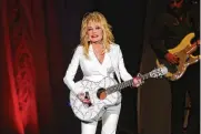  ?? PHOTO BY WADE PAYNE/INVISION/AP, FILE ?? Dolly Parton performs in concert on July 31, 2015, in Nashville, Tennessee. Parton has been inducted into the Rock & Roll Hall of Fame.
