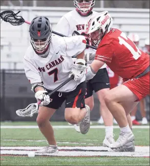  ?? Dave Stewart / Hearst Connecticu­t Media ?? New Canaan’s Hayden Shin (7) and Fairfield Prep’s Ted Bednar (17) scramble for the ball on a faceoff during a boys lacrosse game on Monday in New Canaan.