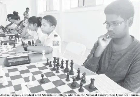  ??  ?? Joshua Gopaul, a student of St Stanislaus College, who won the National Junior Chess Qualifier Tournament last Sunday at the National Aquatic Centre, Liliendaal. The tournament qualified eight junior players for the National Chess Championsh­ip...