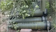  ?? ASSOCIATED PRESS FILE PHOTO ?? U.S.-supplied M777 howitzer shells lie on the ground to fire at Russian positions in Ukraine’s eastern Donbas region June 18.