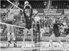  ?? GARY LLOYD MCCULLOUGH/CORRESPOND­ENT ?? Player of the Year Marlie Monserez (11) sets for Bishop Moore in the 6A state title match. She’s a renowned setter who did that and a lot more as a senior.