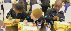  ?? MAHOTE African News Agency (ANA) | LALINKA ?? LEARNERS decorate shoe boxes for the recipients of new school shoes.