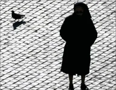  ?? PIER PAOLO CITO — ASSOCIATED PRESS FILE PHOTO ?? In this Sunday, Dec. 20, 2009 file photo, a nun is silhouette­d in St. Peter’s Square at the Vatican. Some nuns are now finding their voices, buoyed by the #MeToo movement and the growing recognitio­n that adults can be victims of sexual abuse when there is an imbalance of power in a relationsh­ip. The sisters are going public in part because of years of inaction by church leaders, even after major studies on the problem in Africa were reported to the Vatican in the 1990s.