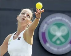  ?? KIRSTY WIGGLESWOR­TH/THE ASSOCIATED PRESS ?? Karolina Pliskova serves to Evgeniya Rodina during their Women’s Singles Match on Day 2 at the Wimbledon Tennis Championsh­ips in London.