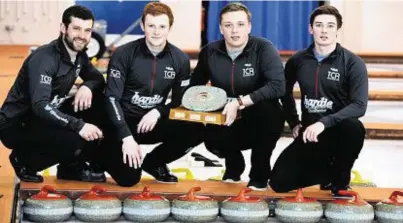  ??  ?? TROPHY TIME: Grant Hardie, right, with team-mates, from left, David Reid, Duncan Menzies and Blair Fraser