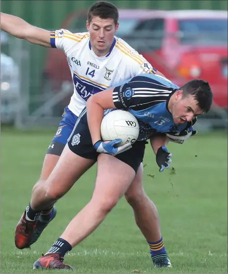  ??  ?? David O’Byrne of St Colmcille’s is pursued by Ratoath’s Gavin McGowan during their SFC clash last Friday.