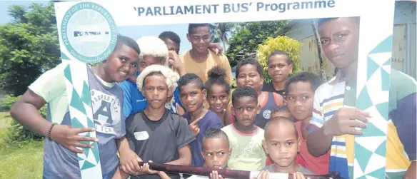  ??  ?? Children of Naiseuseu Village in Beqa take a selfie after the Parliament Bus programme.