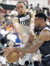  ?? John Locher Associated Press ?? BRICE JOHNSON, left, of the Clippers challenges Joel Bolomboy of the Jazz in a summer league game.