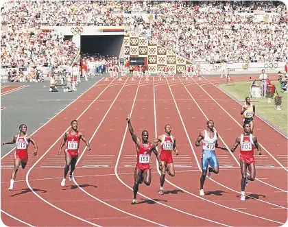  ??  ?? ■ Ben Johnson, arm aloft, celebrates Olympic 100m victory – but he’d later be disqualifi­ed for cheating.