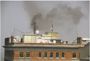  ?? Justin Sullivan / Getty Images ?? Black smoke billows from the Russian Consulate in San Francisco after staff apparently burned items.