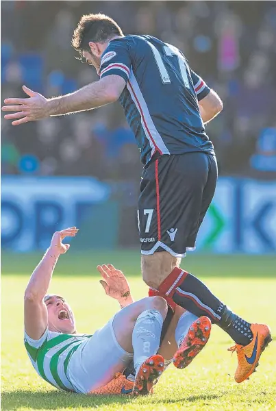  ??  ?? STEPPING LIGHTLY: Ross Draper and Celtic skipper Scott Brown at Victoria Park)