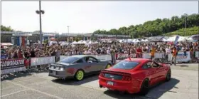  ?? PHOTO COURTESY OF TURN5 ?? AmericanMu­scle customers and spectators gather for a crowd favorite, the Flowmaster Exhaust Revving Competitio­n during the annual Turn5 Mustang show held in June. Other events at the one-day event included the Rev-X Dyno Competitio­n, McLeod Burnout Competitio­n and VMP Performanc­e Exhibition Races.