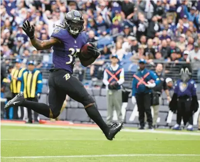  ?? NICK WASS/AP ?? Ravens running back Gus Edwards scores a touchdown against the Cleveland Browns on Oct. 23 at M&T Bank Stadium.