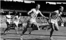  ?? Photograph: SF/AP ?? Thane Baker (centre) hands the baton to Bobby Joe Morrow in the first heat of the 4x100 in Melbourne.