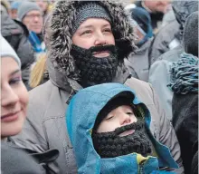  ??  ?? Sarah Castellani and her son Riley Ruckstuhl wore beards as a tribute to Mike Taylor. Various artists performed at Burlington's Civic Square. Taylor, just 51, died in his sleep Dec. 30.