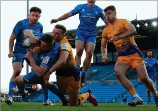  ??  ?? UNSTOPPABL­E: Jordan Larmour powers over for Leinster’s third try to sink Exeter