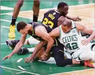  ?? Scott Strazzante / The Chronicle ?? The Celtics’ Al Horford falls on the Warriors’ Stephen Curry’s leg during a scramble in fourth quarter of the Celtics’ 116-100 victory in Game 3 of NBA Finals at TD Garden in Boston on Wednesday.
