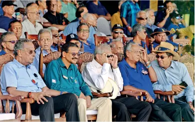  ?? ?? MAIDEN APPEARANCE; Old Royalist Ranil Wickremesi­nghe makes his debut as the President of Lanka at the annual Battle of the Blues and watches intently when Thomian grit failed to steal the Royalist thunder. Pic by Eshan Fernando