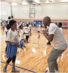  ??  ?? Memphis men’s basketball coach Penny Hardaway instructs a camper at his basketball camp on Wednesday. MARK GIANNOTTO/THE COMMERCIAL APPEAL