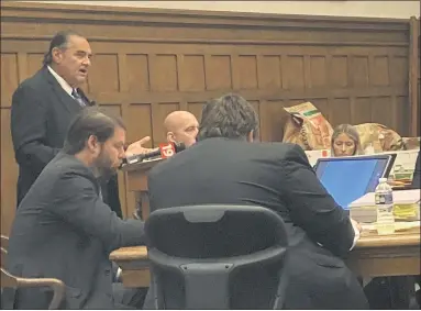  ?? ANDREW CASS/THE NEWS-HERALD ?? Defense attorney Angelo F. Lonardo speaks at the podium during opening arguments Sept. 20. He is representi­ng Blake E. Sargi , seated at right, who is accused in the shooting deaths of two people in a January 2020 incident in Concord Township.