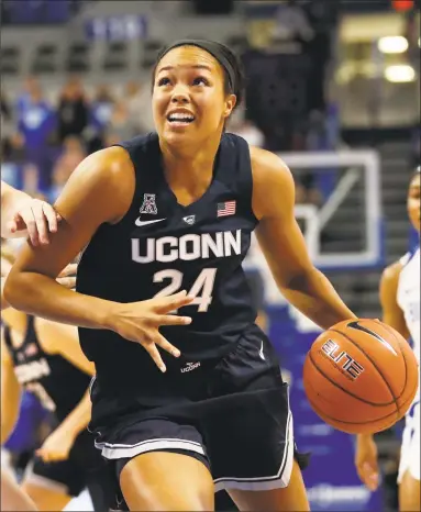  ?? Jeff Roberson / Associated Press ?? UConn’s Napheesa Collier heads to the basket during Tuesday night’s game in St. Louis. Collier, who is from St. Louis, finished with 22 points and 11 rebounds in a 98-42 win.