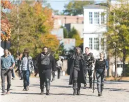  ?? PHOTO BY GENE PAGE / AMC ?? Andrew Lincoln as Rick Grimes, Khary Payton as Ezekiel, Chandler Riggs as Carl Grimes, Melissa McBride as Carol Peletier, Cooper Andrews as Jerry and Daniel Newman as Daniel perform in a scene from “The Walking Dead.” Much of episode 16 of season 7 was...