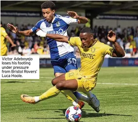  ?? ?? Victor Adeboyejo loses his footing under pressure from Bristol Rovers’ Luca Hoole.