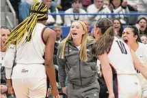  ?? Tyler Sizemore/Hearst Connecticu­t Media ?? Injured UConn guard Paige Bueckers cheers on her teammates during No. 1 South Carolina’s win over No. 5 UConn in a NCAA women’s basketball game in Hartford Feb. 5.