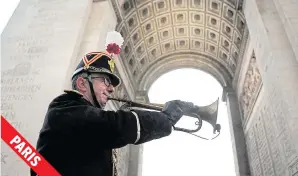  ??  ?? The original 1918 Armistice bugle is sounded under the Arc de Triomphe