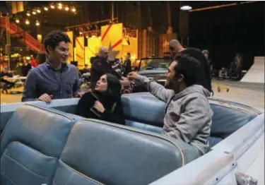  ?? KEVIN ESTRADA — FOX VIA AP ?? Thomas Kail, Vanessa Hudgens and Carlos PenaVega rehearse for “Grease: Live.”