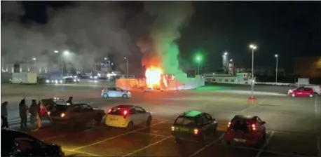  ?? PRO NEWS — VIA THE ASSOCIATED PRESS ?? A video image shows a COVID-19testing center that was set on fire in Urk, 50miles northeast of Amsterdam on Saturday. Youths were protesting on the first night of the country’s curfew.