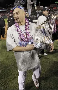  ?? AP file photo ?? Shane Victorino carries the Commission­er’s Trophy after the Phillies won the World Series on Oct. 29, 2008. Victorino was also on the Red Sox’s 2013 World Series championsh­ip team.