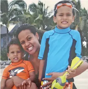  ??  ?? Fiji Airways Captain Seini Koroitaman­a Cornish with her two sons, Alfred (right) and Seth (left).