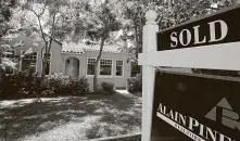  ?? Paul Sakuma / Associated Press ?? The average rate for a 30-year fixed-rate mortgage fell to 3.23 percent, but economic turmoil has meant fewer buyers.