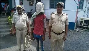  ??  ?? Nabbed: The alleged rapist is held at the Mufasil police station before being sent to judicial custody in Pakur district. — AFP