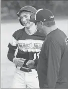  ?? Scott Herpst ?? Jayden Patterson gets a fist bump following a base hit in a recent contest. The senior went 6 of 9 at the plate in two games this past weekend.