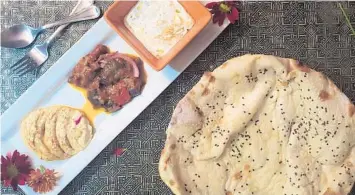  ??  ?? Lavash at Beyti is baked in-house, and reheats beautifull­y in the oven. It’s served here alongside hummus, sauteed eggplant and haydari. AMY DREW THOMPSON/ORLANDO SENTINEL